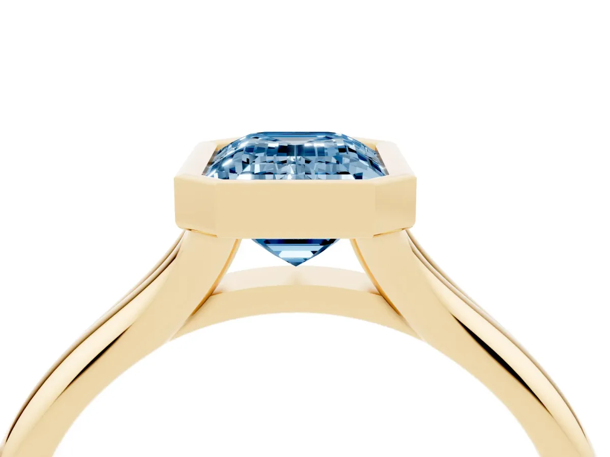 Fancy Blue Bezel Set Emerald Cut Solitaire Diamond Ring with Smooth Band Yellow gold