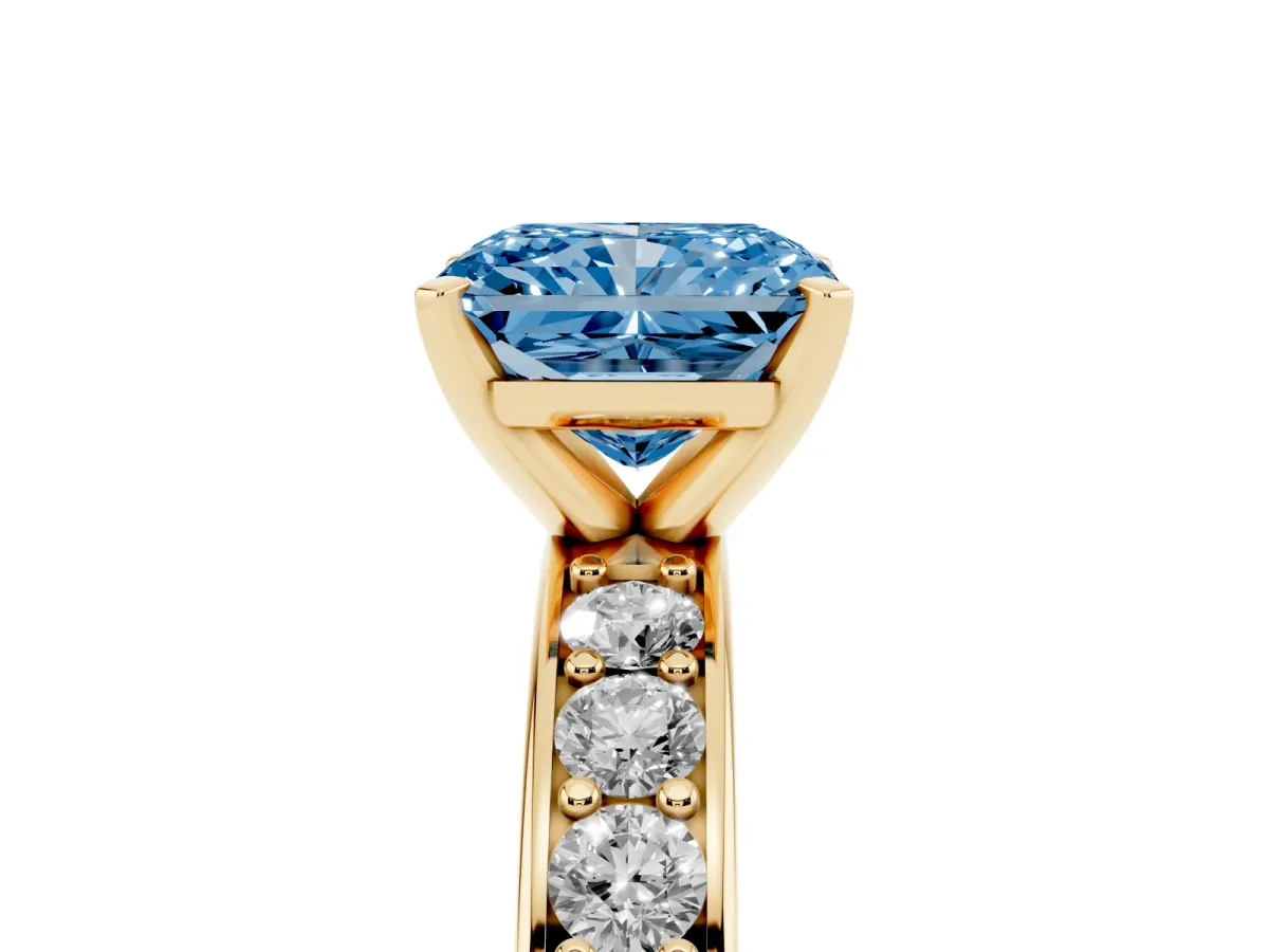 Fancy Blue Radiant Cut Diamond Engagement Ring with Channel Set Round Band and Prong Setting Yellow gold