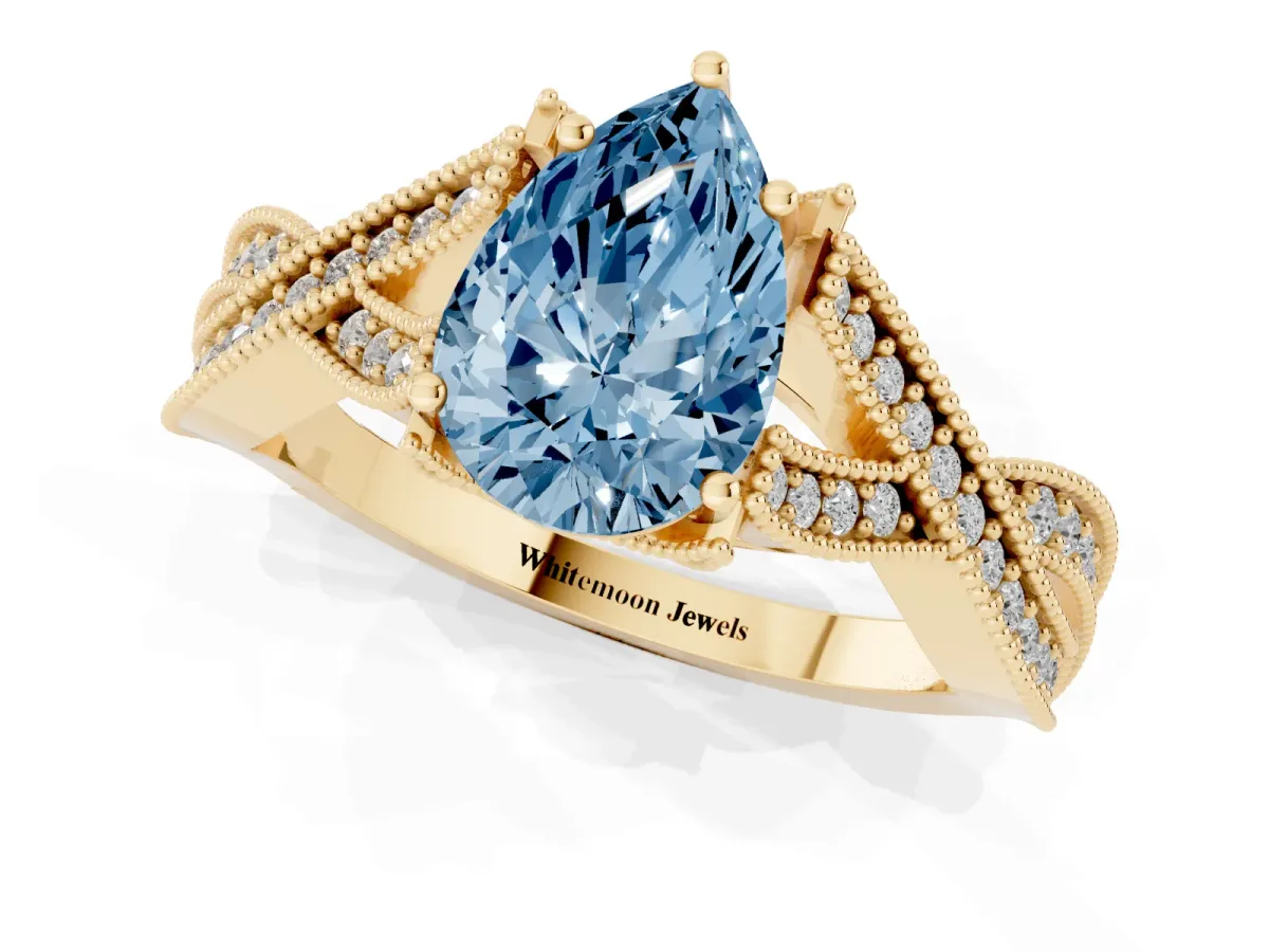 Fancy Blue Pear Cut Cut Diamond Twisted Band with Milgrain Pave Setting and Four-Prong Setting Yellow gold