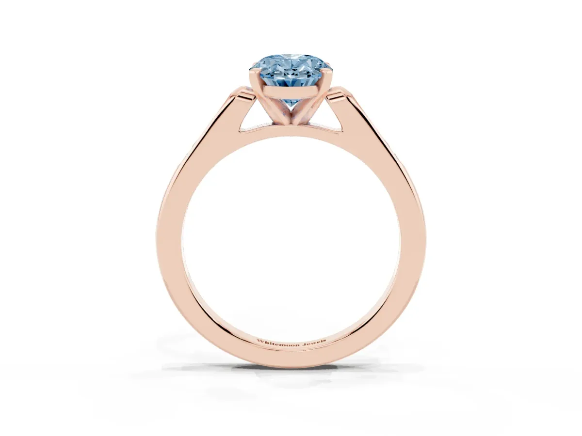 Fancy Blue Oval Cut Diamond Solitaire Ring with Channel Set Round Band and Prong Setting Rose gold