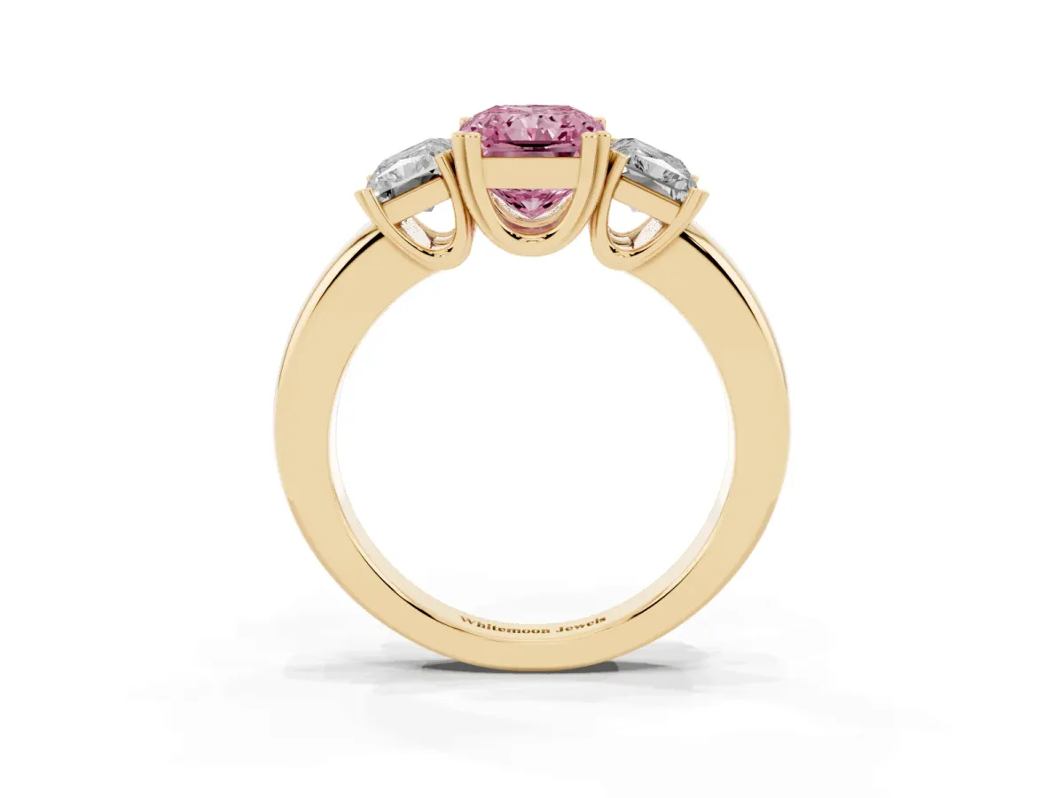 Fancy Pink Three-Stone Radiant Cut Cut Diamond Ring with Channel Set Band and Four-Prong Setting Yellow gold
