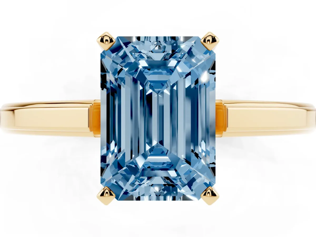Fancy Blue Emerald Cut Solitaire Diamond Ring with Four-Prong Setting and Classic Band Yellow gold