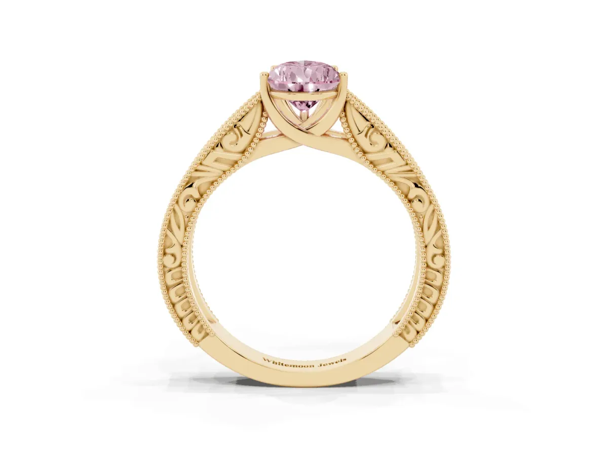Fancy Pink Pear Cut Diamond Solitaire Ring with Engraved Band and Four-Prong Setting Yellow gold