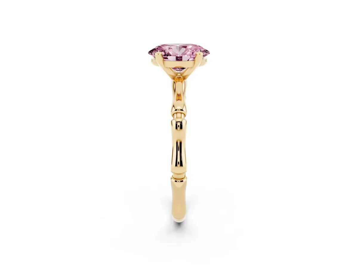 Fancy Pink Oval Cut Solitaire Diamond Ring with Bamboo Band and Four-Prong Setting Yellow gold
