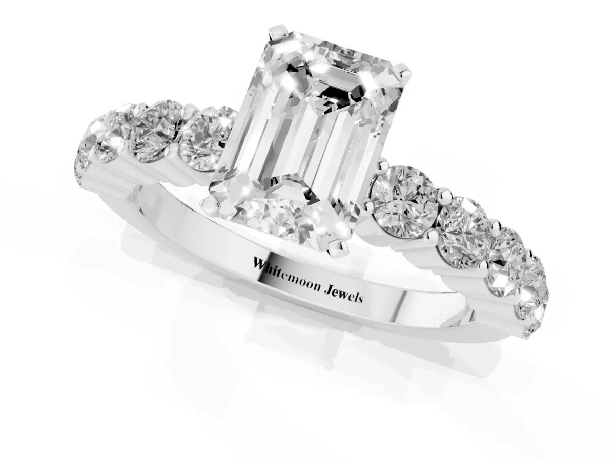 Emerald Cut Diamond Solitaire Ring with Shared Prong Round Side Stones Platinum