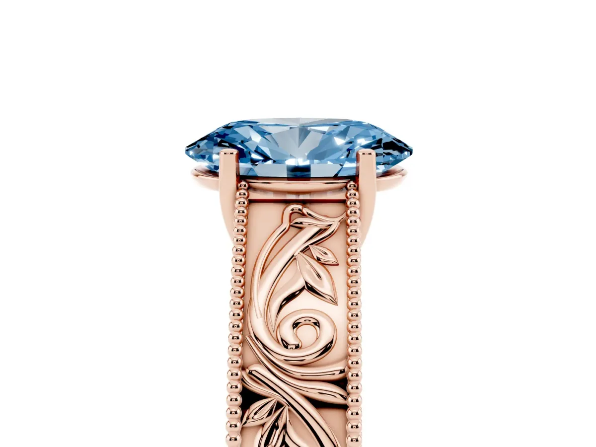 Fancy Blue Oval Cut Diamond Solitaire Ring with Engraved Band and Four-Prong Setting Rose gold