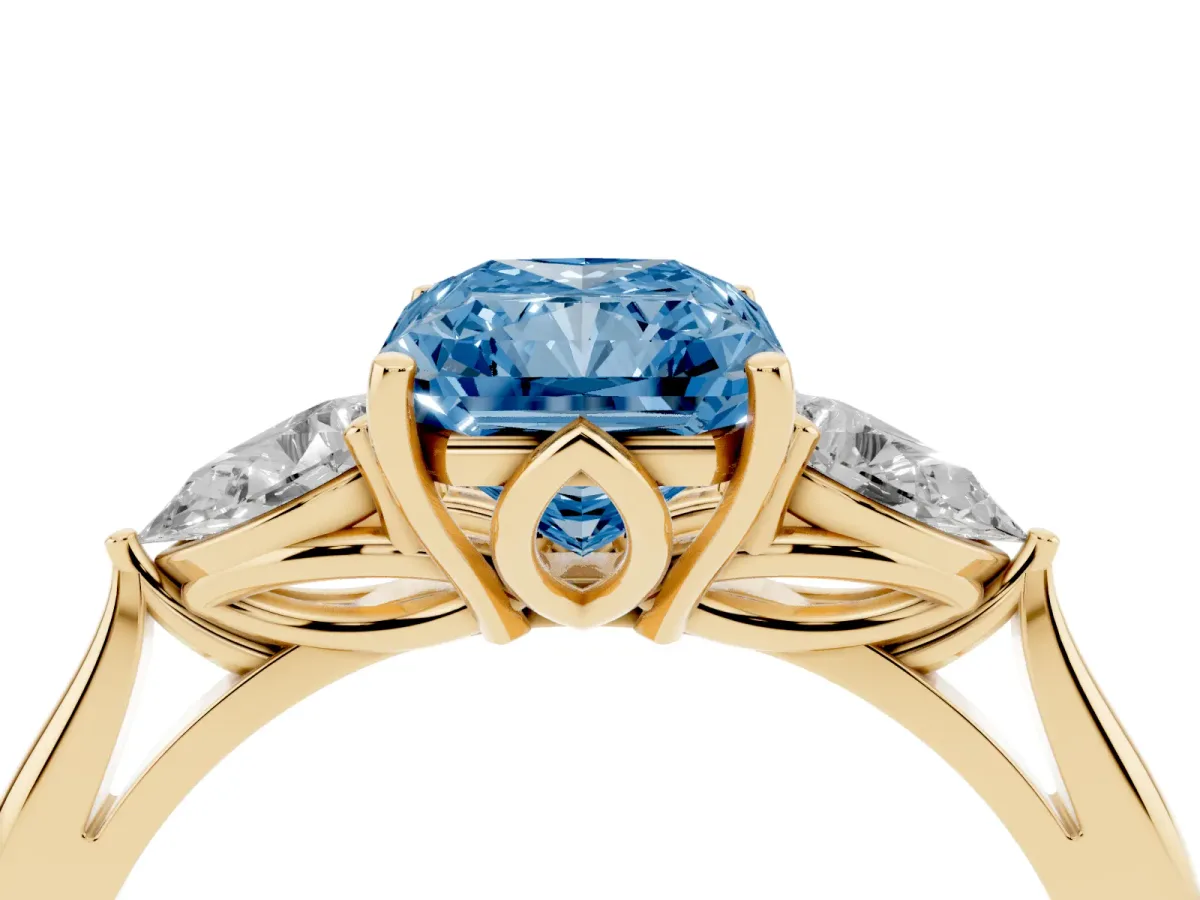 Fancy Blue Radiant Cut Diamond Three-Stone Ring with Pear Side Stones and Prong Setting Yellow gold