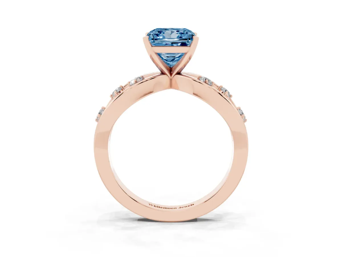 Fancy Blue Princess Cut Cut Solitaire Diamond with Side Stones on Criss-Cross Band and Four-Prong Setting Rose gold