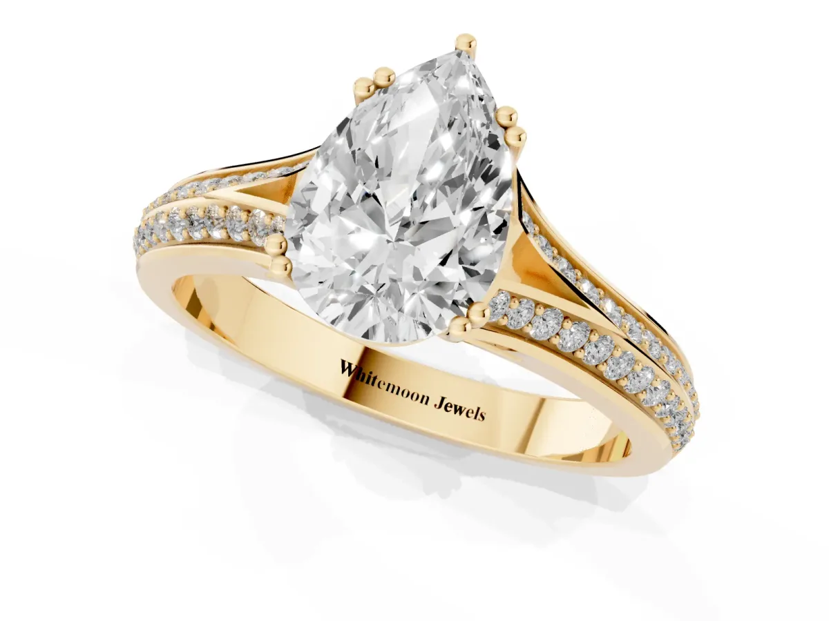 Pear Cut Diamond Split Shank Engagement Ring with Pavé Band Yellow gold