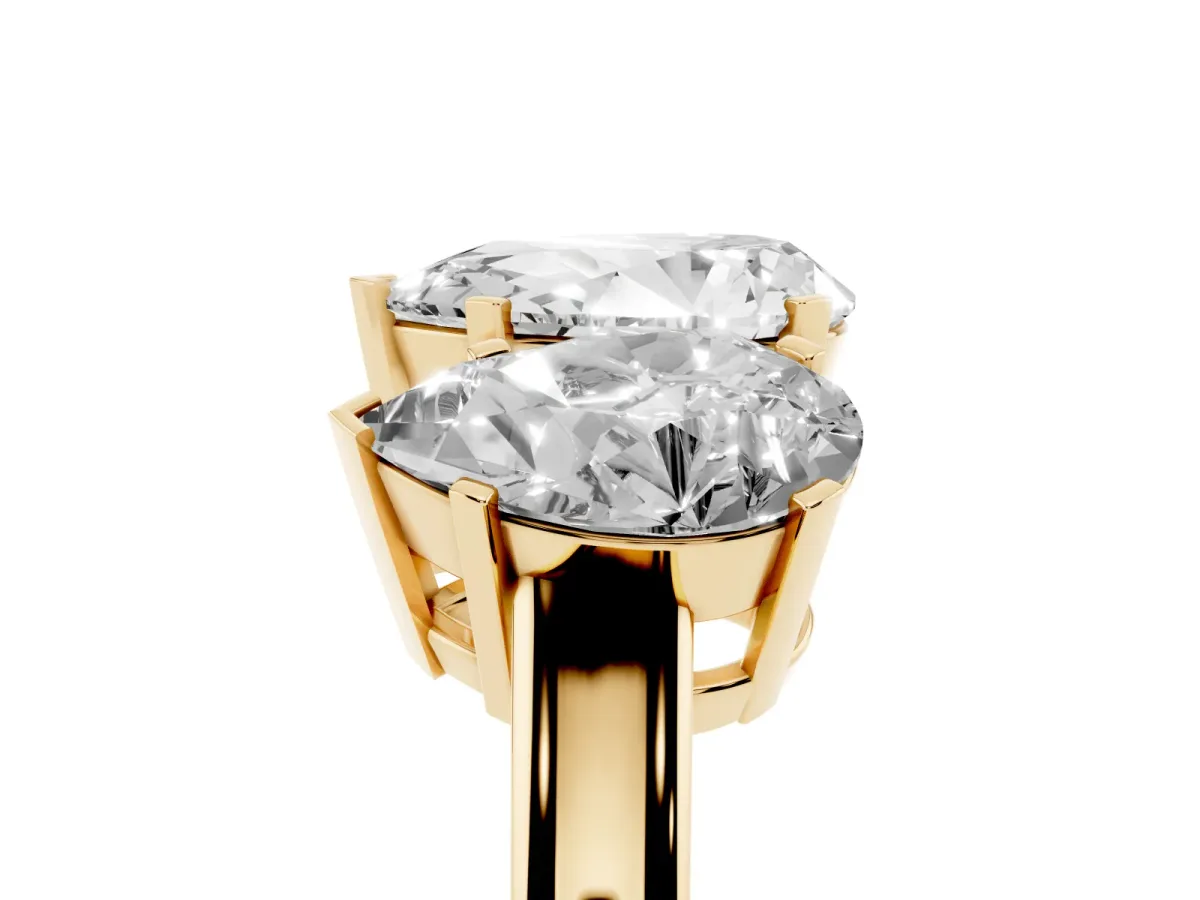 Three-Stone Pear Cut Cut Diamond Ring with Channel Set Band and Four-Prong Setting Yellow gold