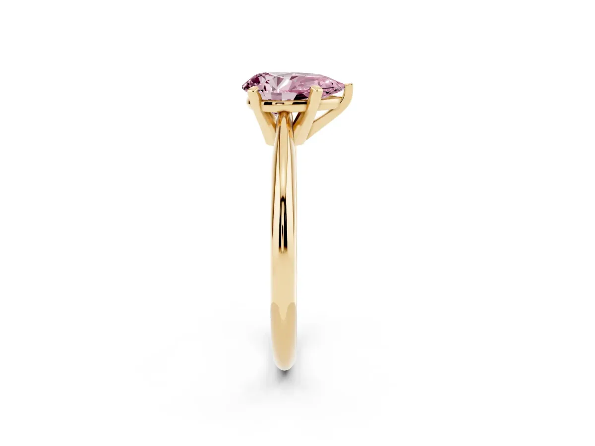Fancy Pink Pear Cut Cut Solitaire Ring with Four-Prong Setting on a Classic Band Yellow gold