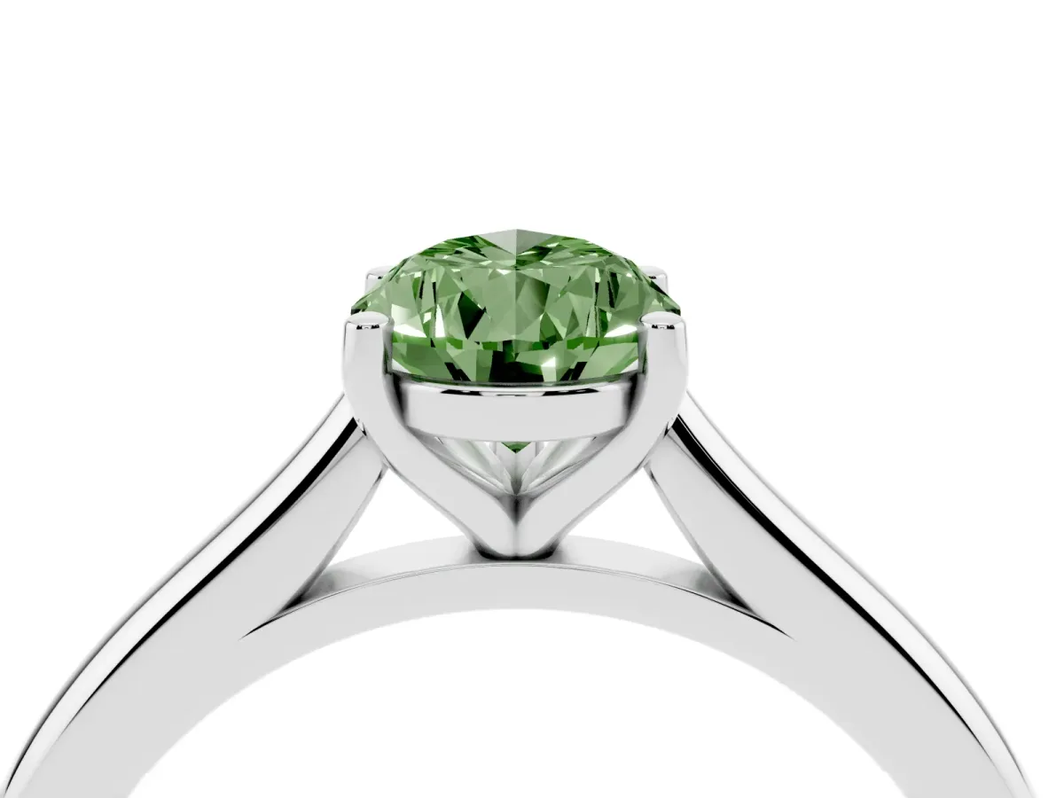 Fancy Green Pear Cut Cut Solitaire Ring with Cathedral Band and Four-Prong Setting Silver
