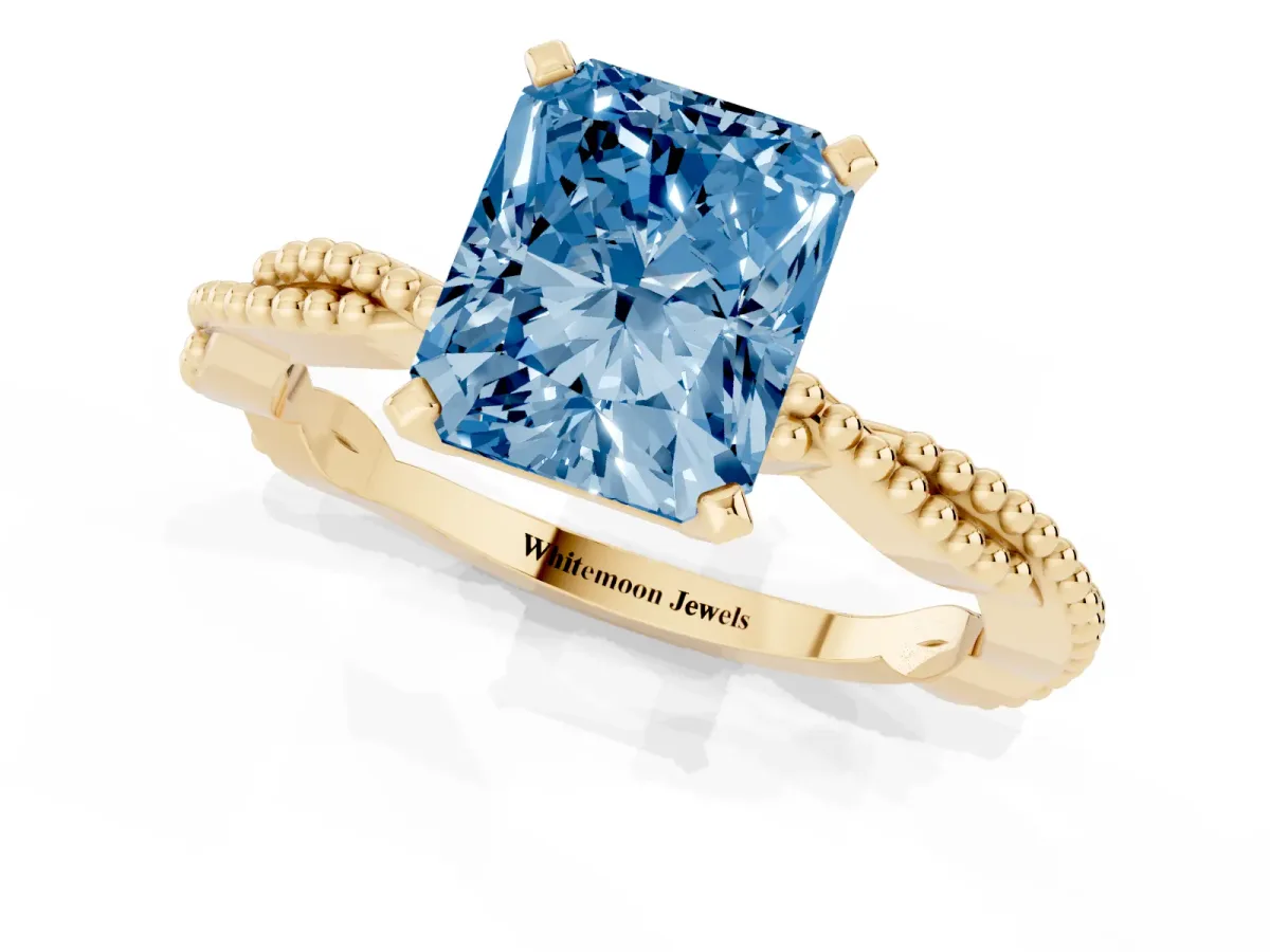 Fancy Blue Radiant Cut Solitaire Twisted Band with Bead Prong Setting Yellow gold
