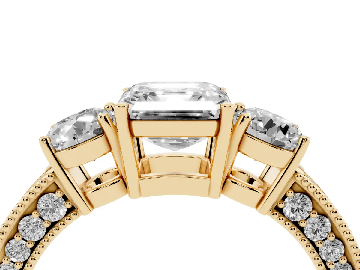Asscher Cut Three-Stone Diamond Ring with Pavé Band and Four-Prong Setting Yellow gold