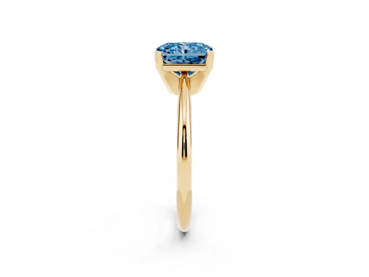 Fancy Blue Radiant Cut Cut Solitaire Ring with Four-Prong Setting on a Classic Band Yellow gold