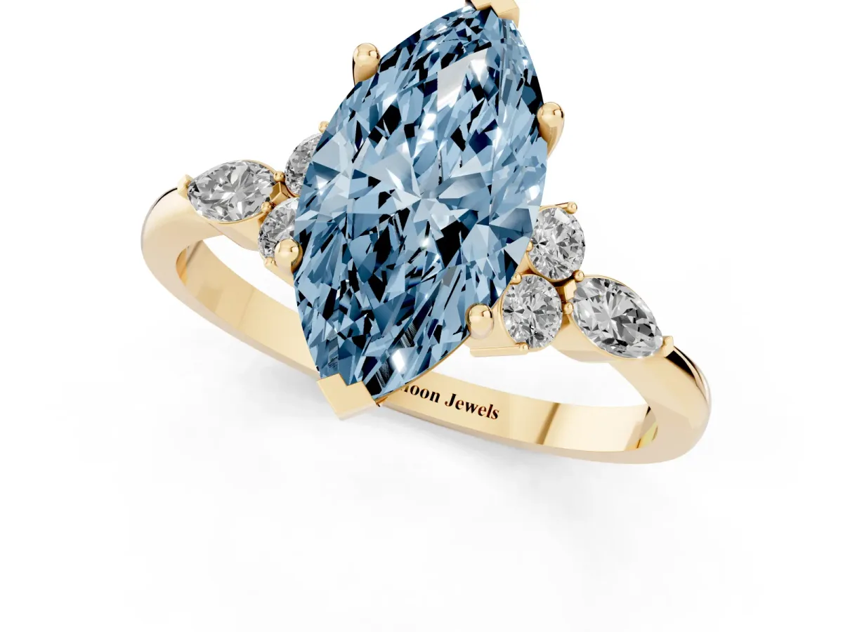 Fancy Blue Marquise Cut Brilliant Diamond Solitaire Ring with Pear Side Stones and Four-Prong Setting Yellow gold