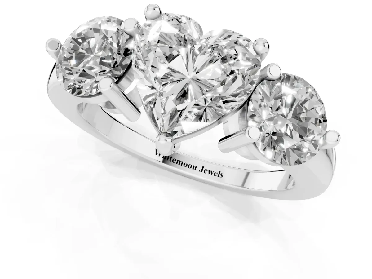 Three-Stone Heart Cut Brilliant Cut Solitaire Ring with Prong Setting on a Classic Band Silver