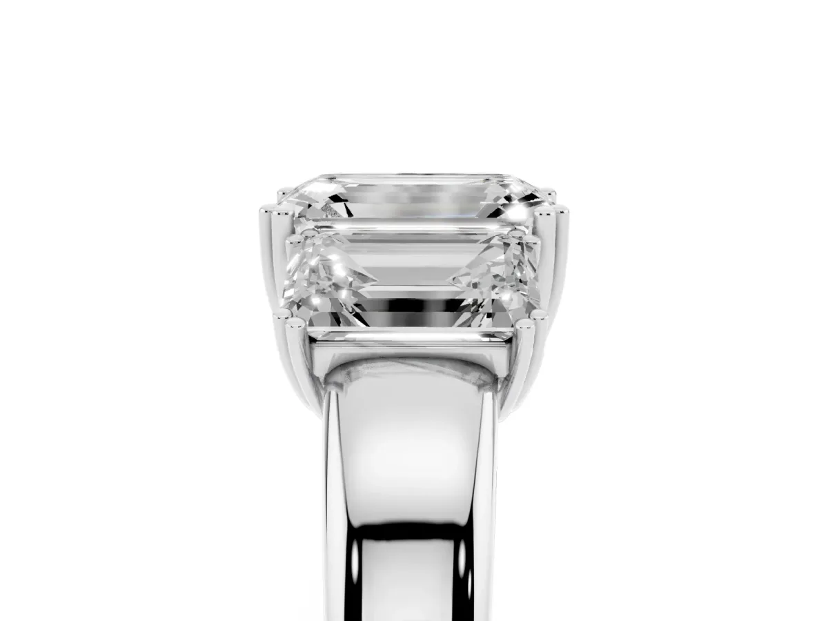 Three-Stone Emerald Cut Cut Diamond Ring with Channel Set Band and Four-Prong Setting Platinum