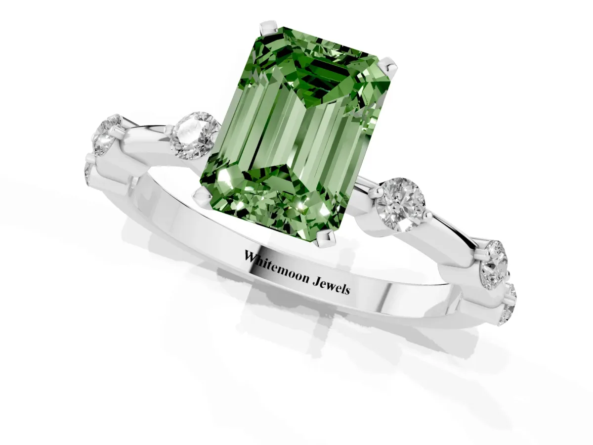 Fancy Green Emerald Cut Solitaire Diamond Ring with Bezel Set Side Stones and Prong Setting Silver
