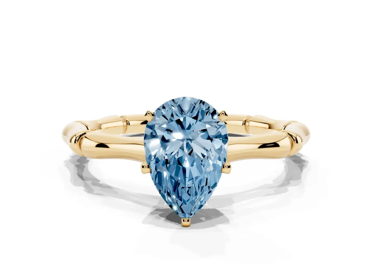 Fancy Blue Pear Cut Solitaire Diamond Ring with Bamboo Band and Four-Prong Setting Yellow gold
