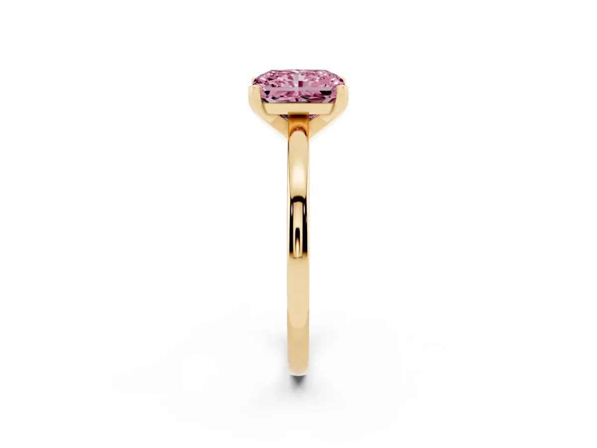 Fancy Pink Radiant Cut Solitaire Diamond Engagement Ring with Four-Prong Setting on a Classic Band Yellow gold