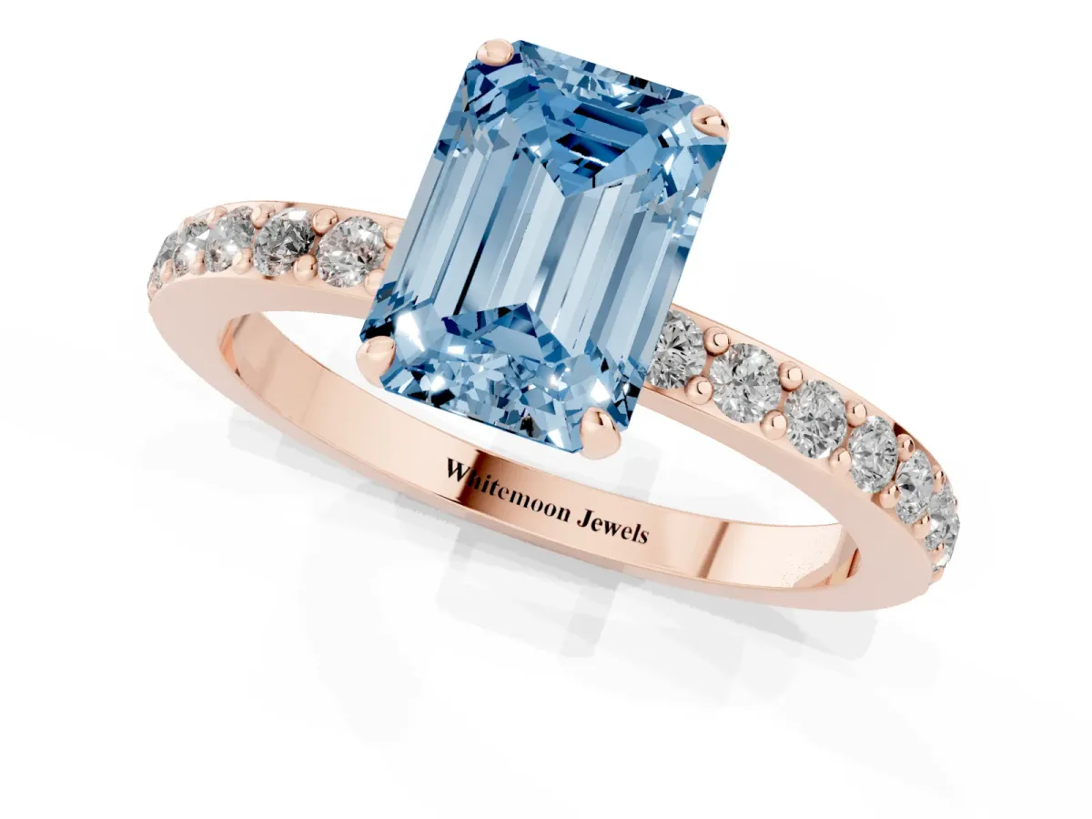 Fancy Blue Emerald Cut Diamond Pavé Engagement Ring with Round Accents and Prong Setting Rose gold