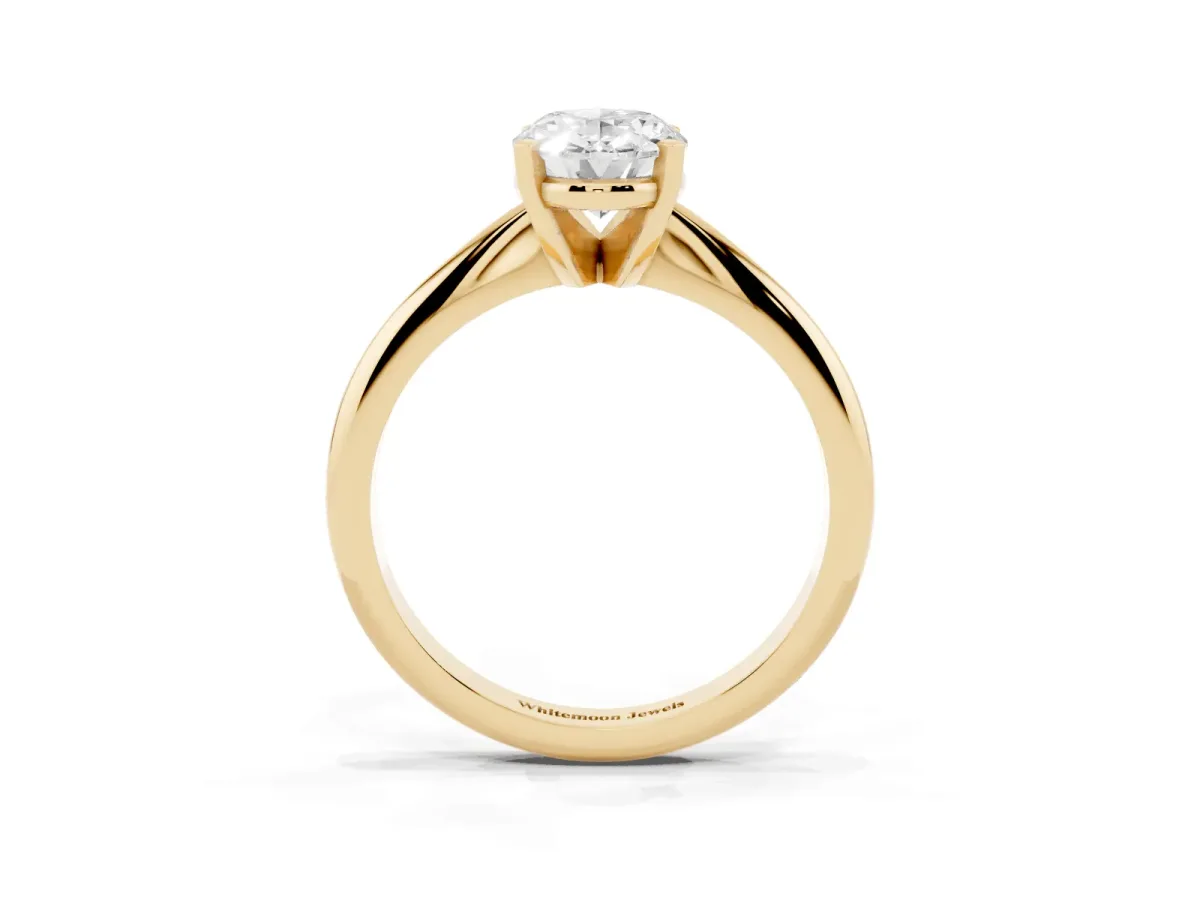 Oval Cut Cut Solitaire Ring with Four-Prong Setting on a Classic Band Yellow gold