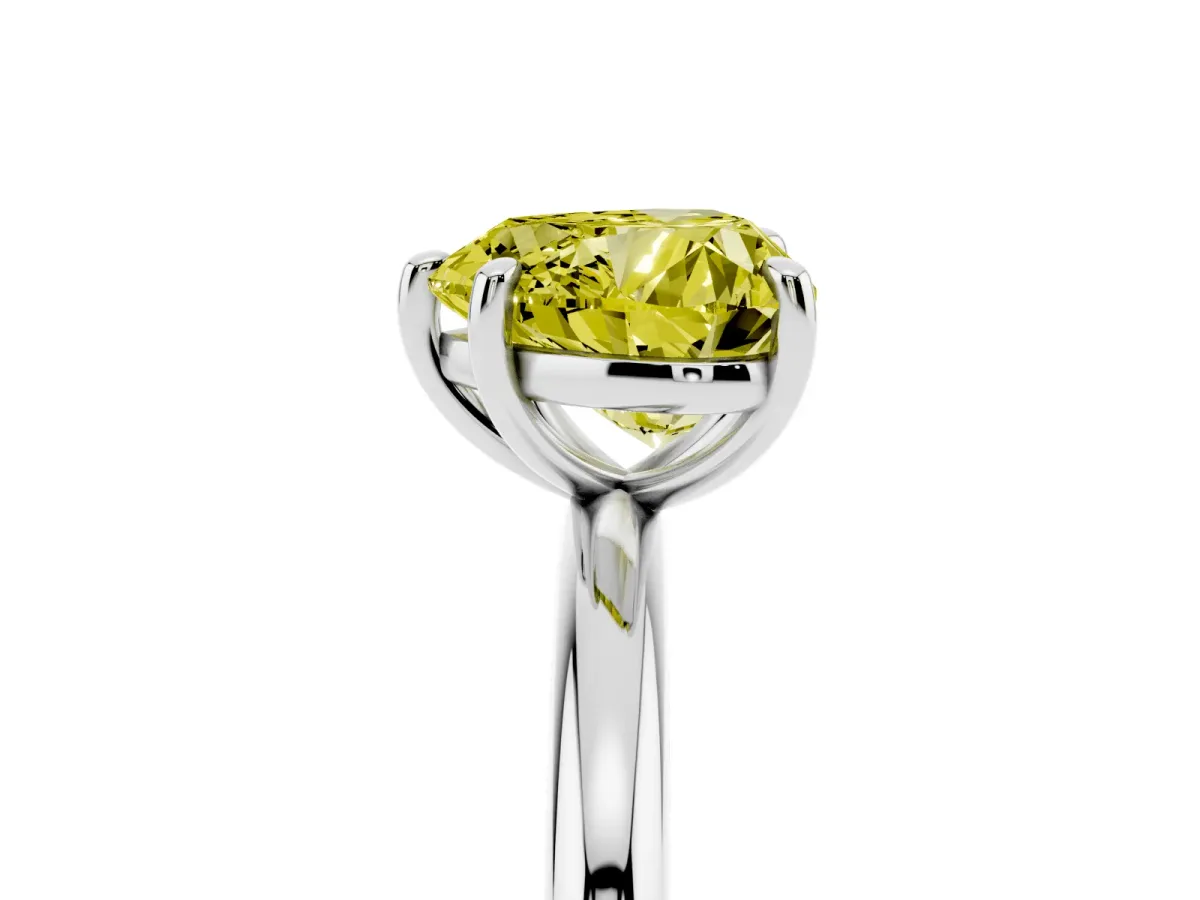 Fancy Yellow Heart Cut Solitaire Diamond Ring with Four-Prong Setting on a Plain Band Platinum