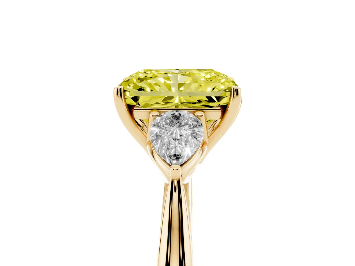 Fancy Yellow Radiant Cut Diamond Three-Stone Ring with Pear Side Stones and Prong Setting Yellow gold