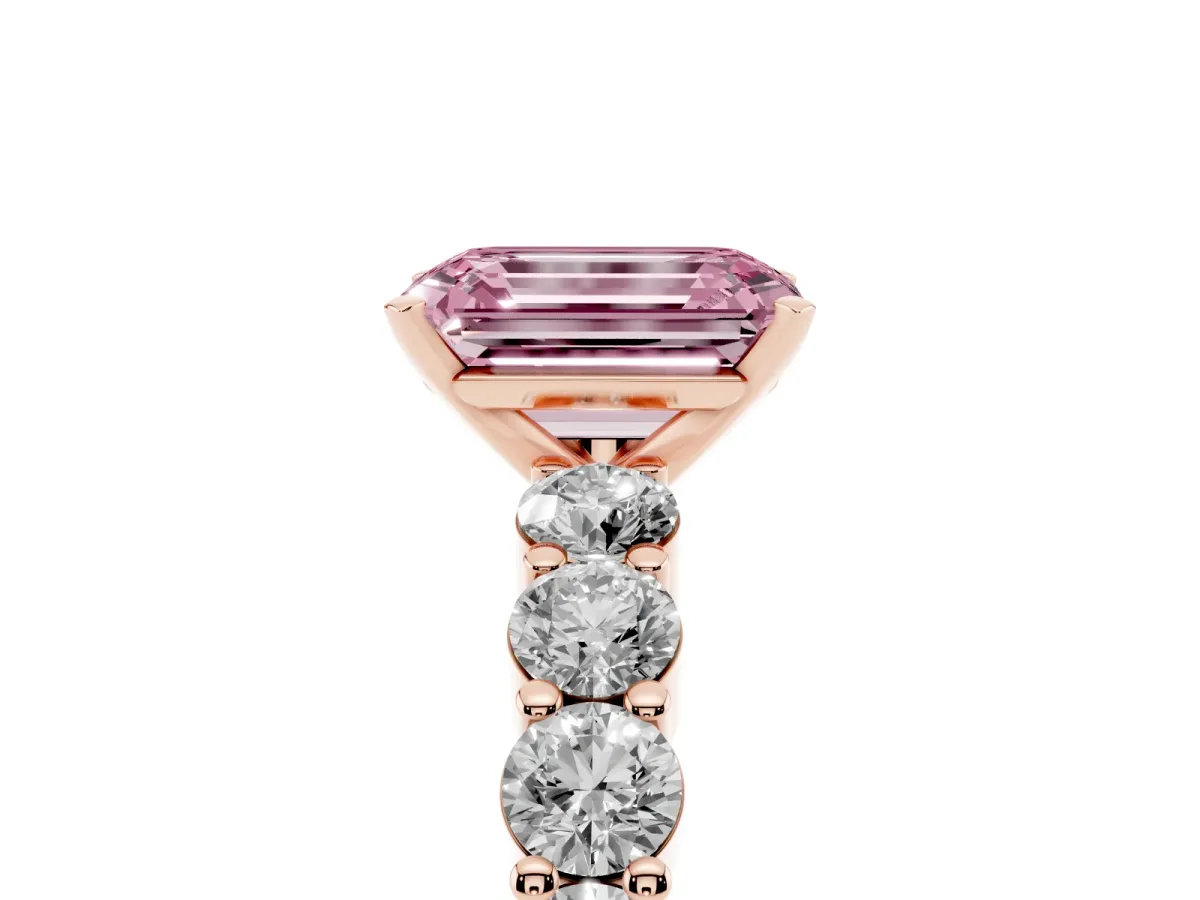 Fancy Pink Emerald Cut Diamond Solitaire Ring with Shared Prong Round Side Stones Rose gold