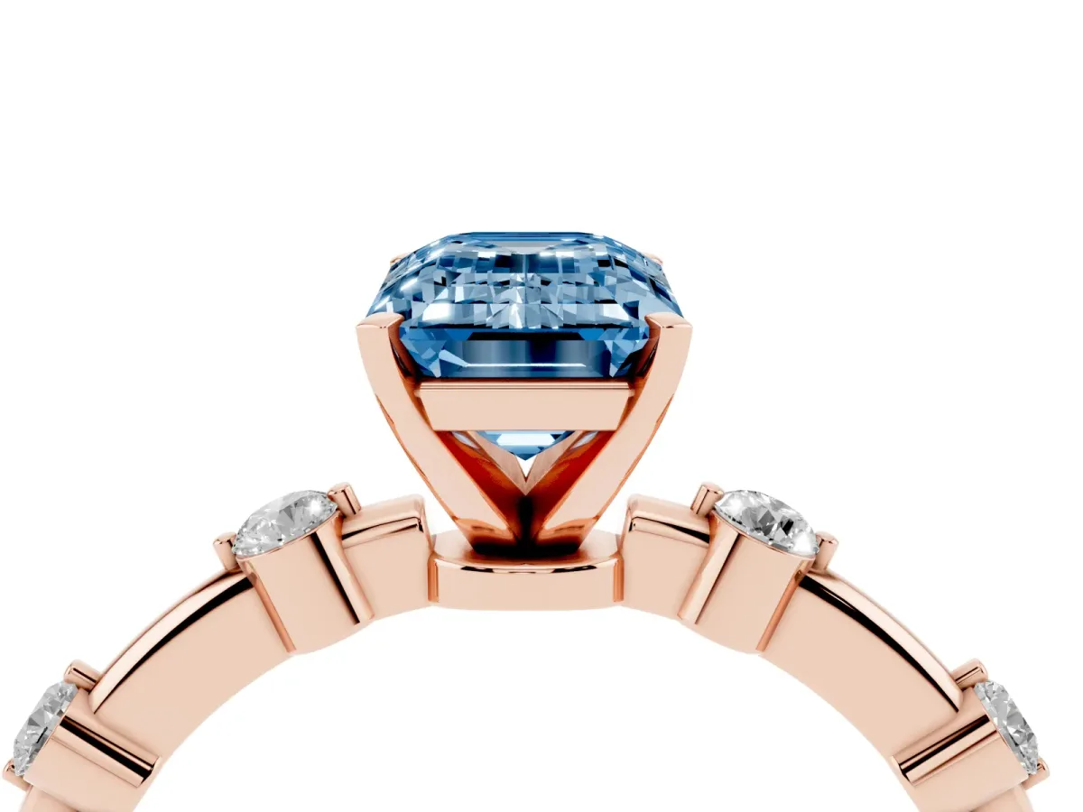 Fancy Blue Emerald Cut Solitaire Diamond Ring with Bezel Set Side Stones and Prong Setting Rose gold