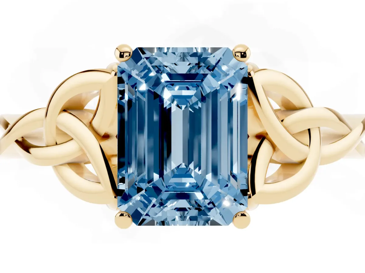 Fancy Blue Emerald Cut Diamond Solitaire Engagement Ring with Celtic Knot Band and Four-Prong Setting Yellow gold