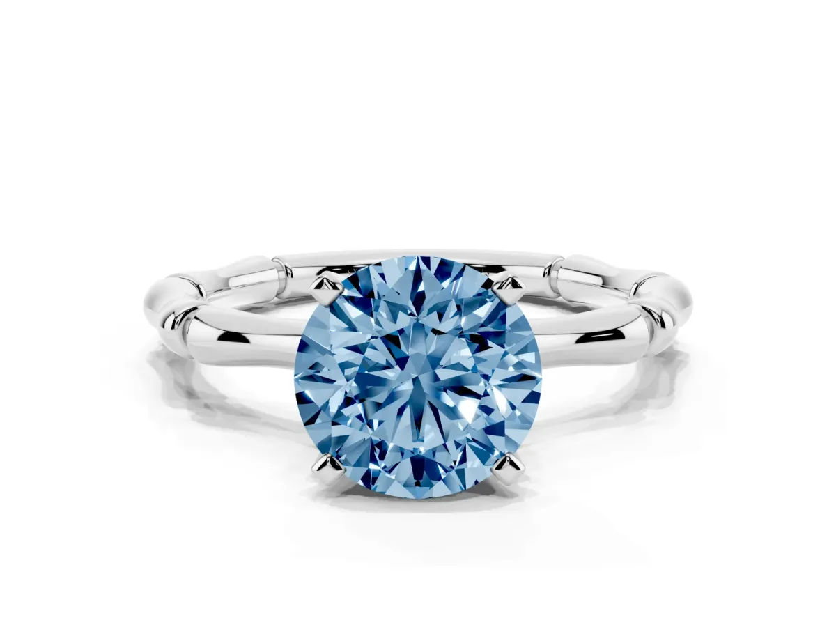 Fancy Blue Round Cut Solitaire Diamond Ring with Bamboo Band and Four-Prong Setting Silver