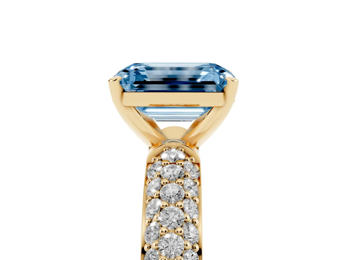 Fancy Blue Emerald Cut Diamond Solitaire Ring with Prong Setting and Pavé Band Yellow gold