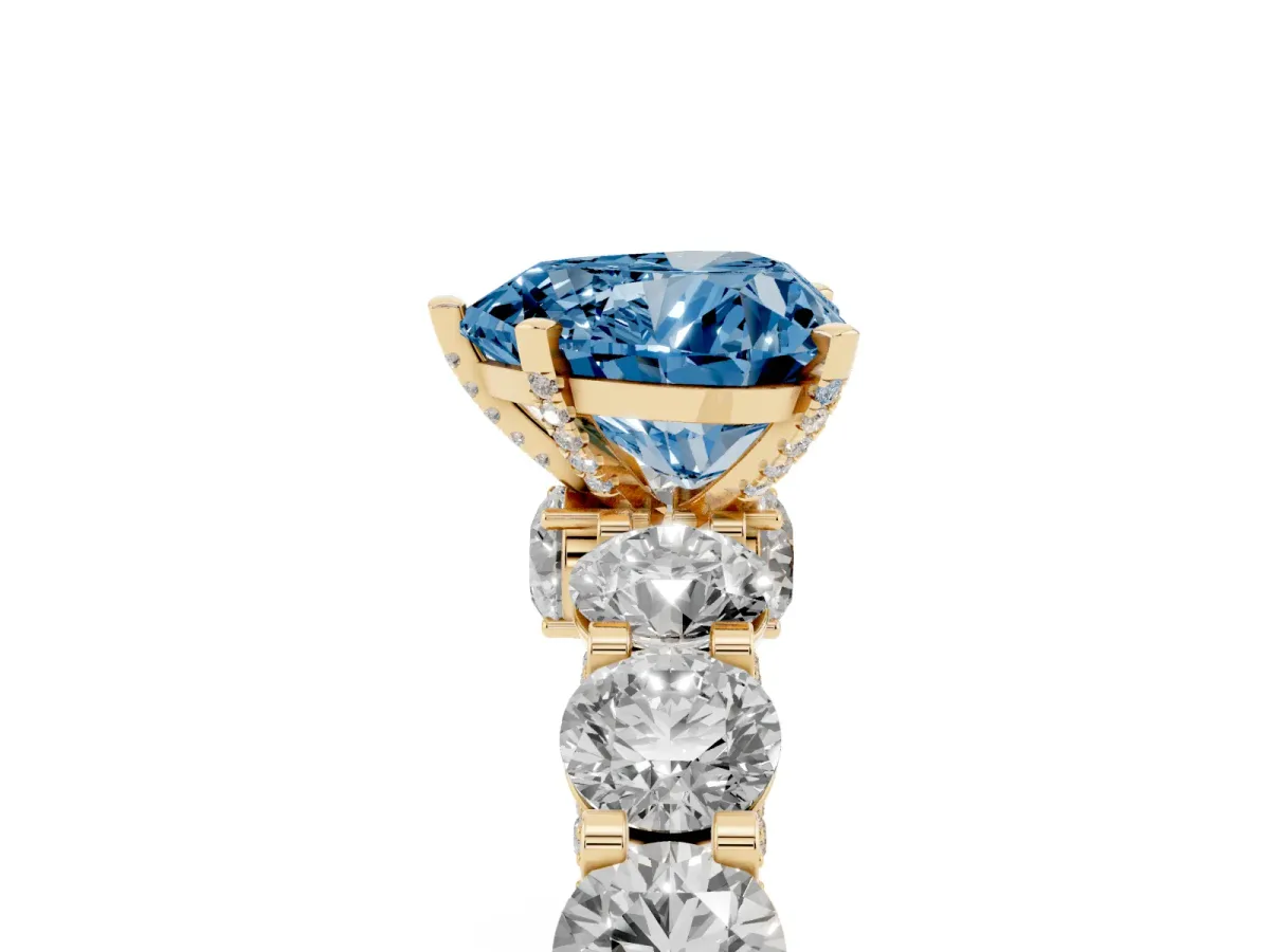 Fancy Blue Heart Cut Diamond Side Stone Engagement Ring with Four-Prong Setting Yellow gold