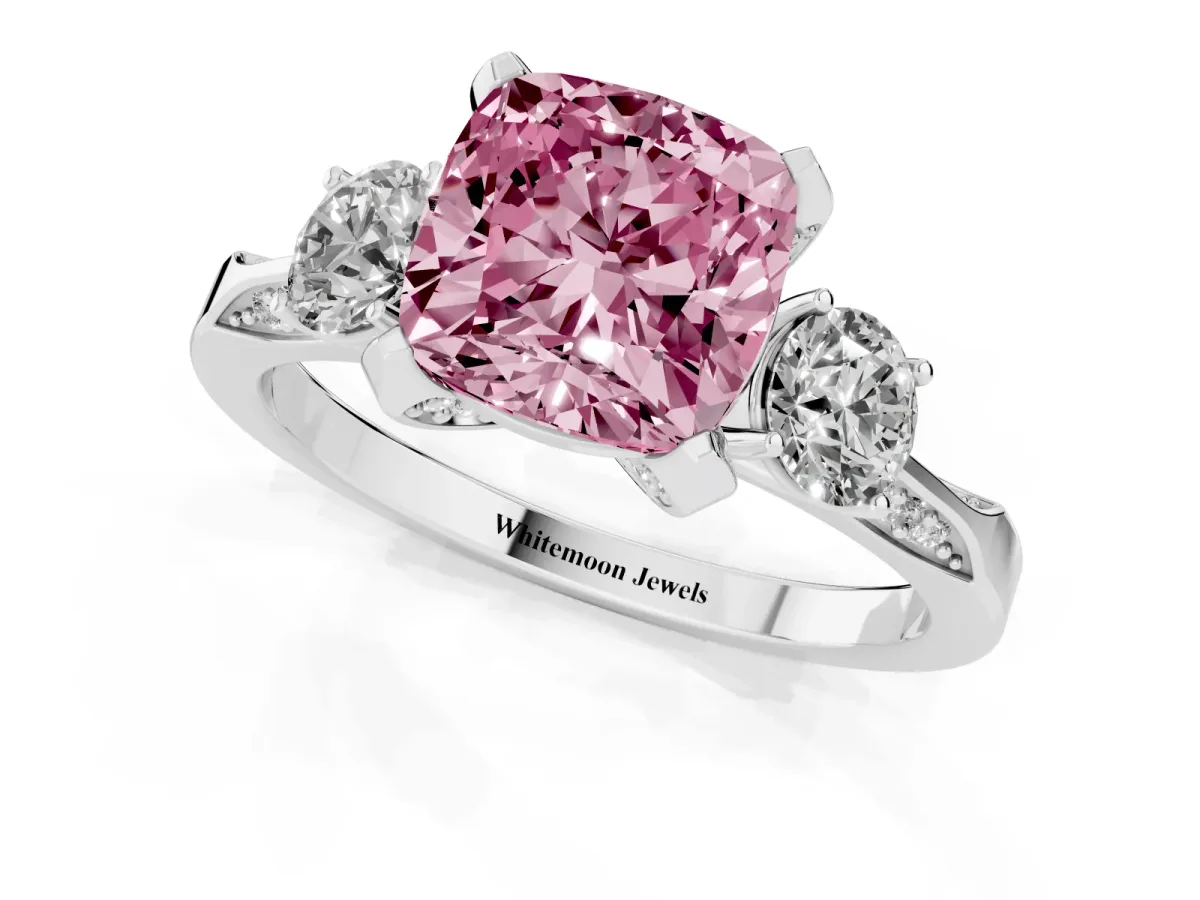 Fancy Pink Cushion Cut Brilliant Three-Stone Diamond Ring with Pavé Band and Four-Prong Setting Platinum