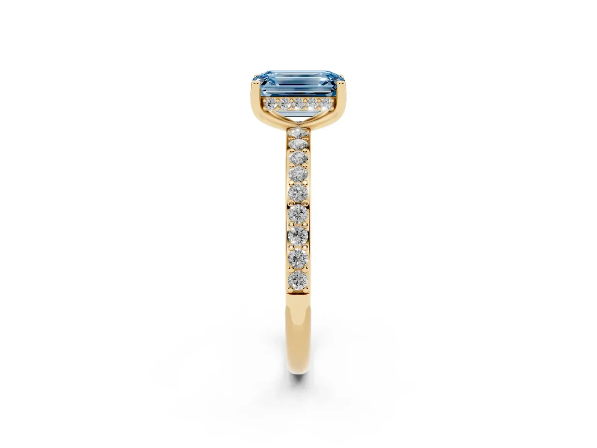 Fancy Blue Emerald Cut Cut Diamond Pavé Band Ring with Four-Prong Setting Yellow gold
