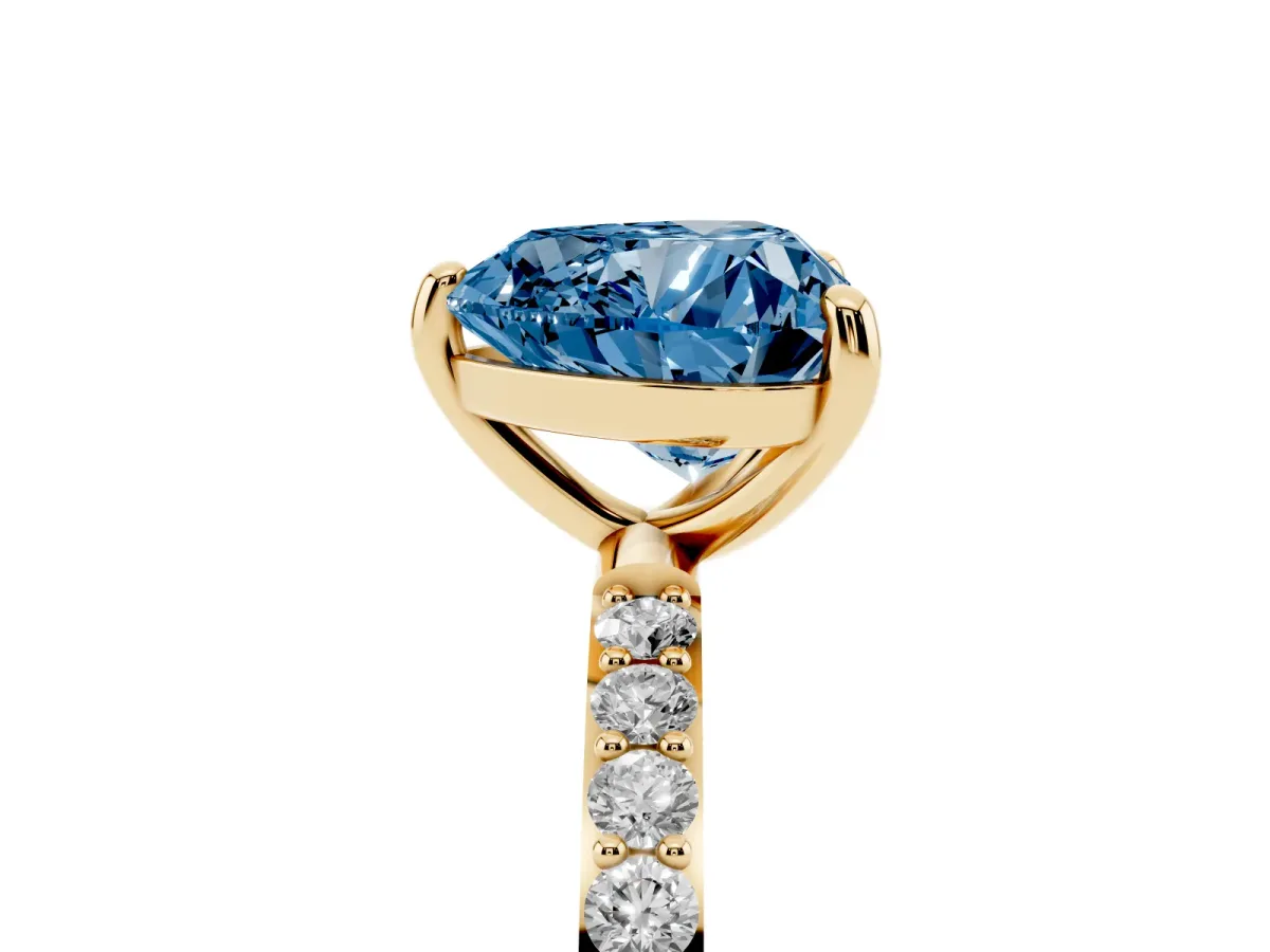 Fancy Blue Heart Cut Diamond Solitaire Ring with Round Pavé Band and Prong Setting Yellow gold