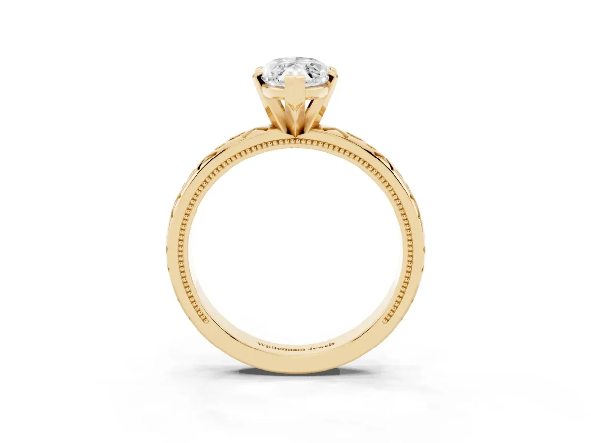 Marquise Cut Solitaire Engagement Ring with Scrollwork Band and Four-Prong Setting Yellow gold