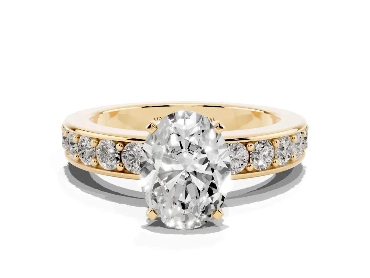 Oval Cut Diamond Engagement Ring with Channel Set Round Band and Prong Setting Yellow gold