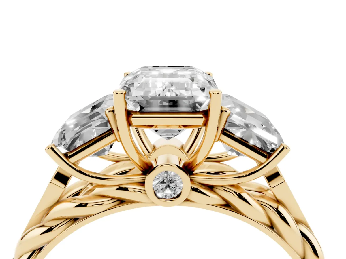 Three-Stone Emerald Cut Diamond Braided Band Ring with Four-Prong Setting Yellow gold