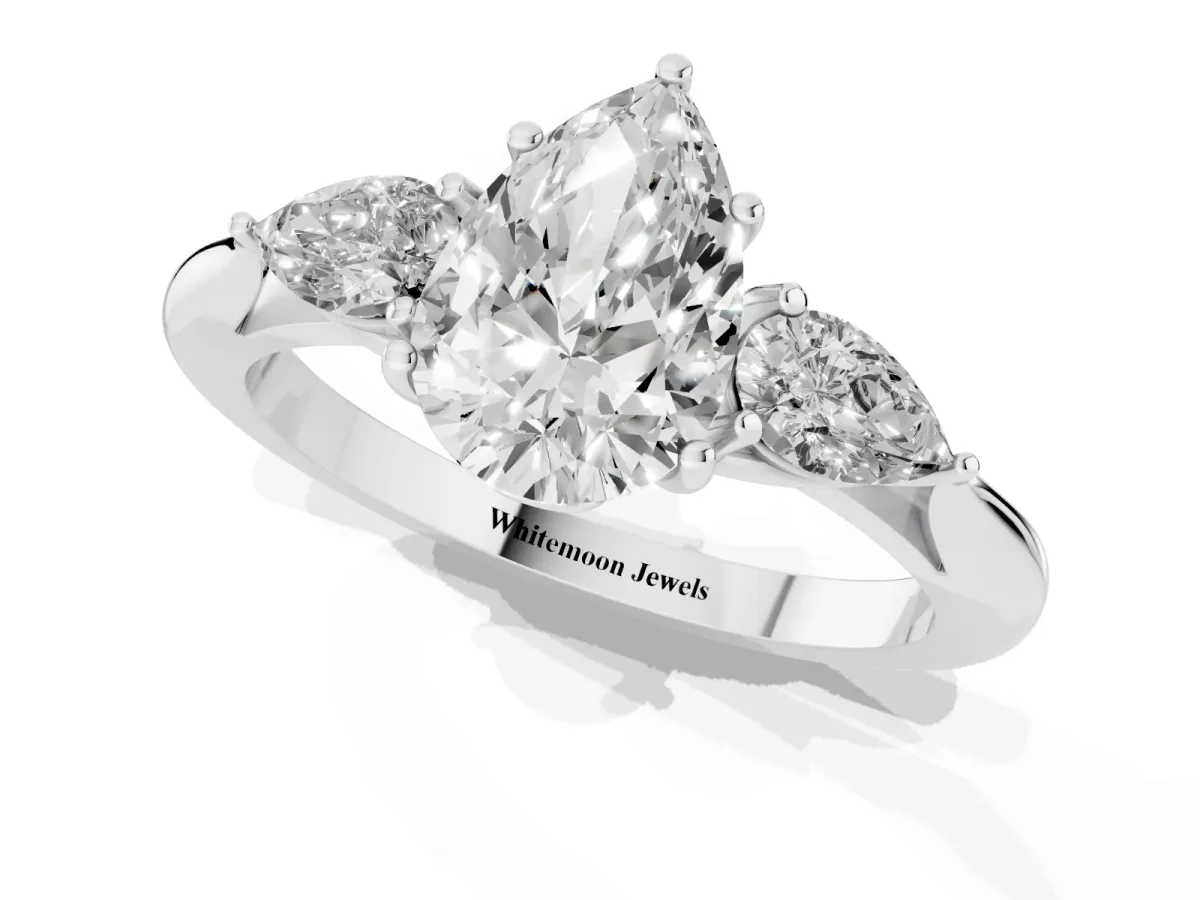 Three-Stone Pear Cut Diamond Ring with Pear Side Stones in Four-Prong Setting Silver