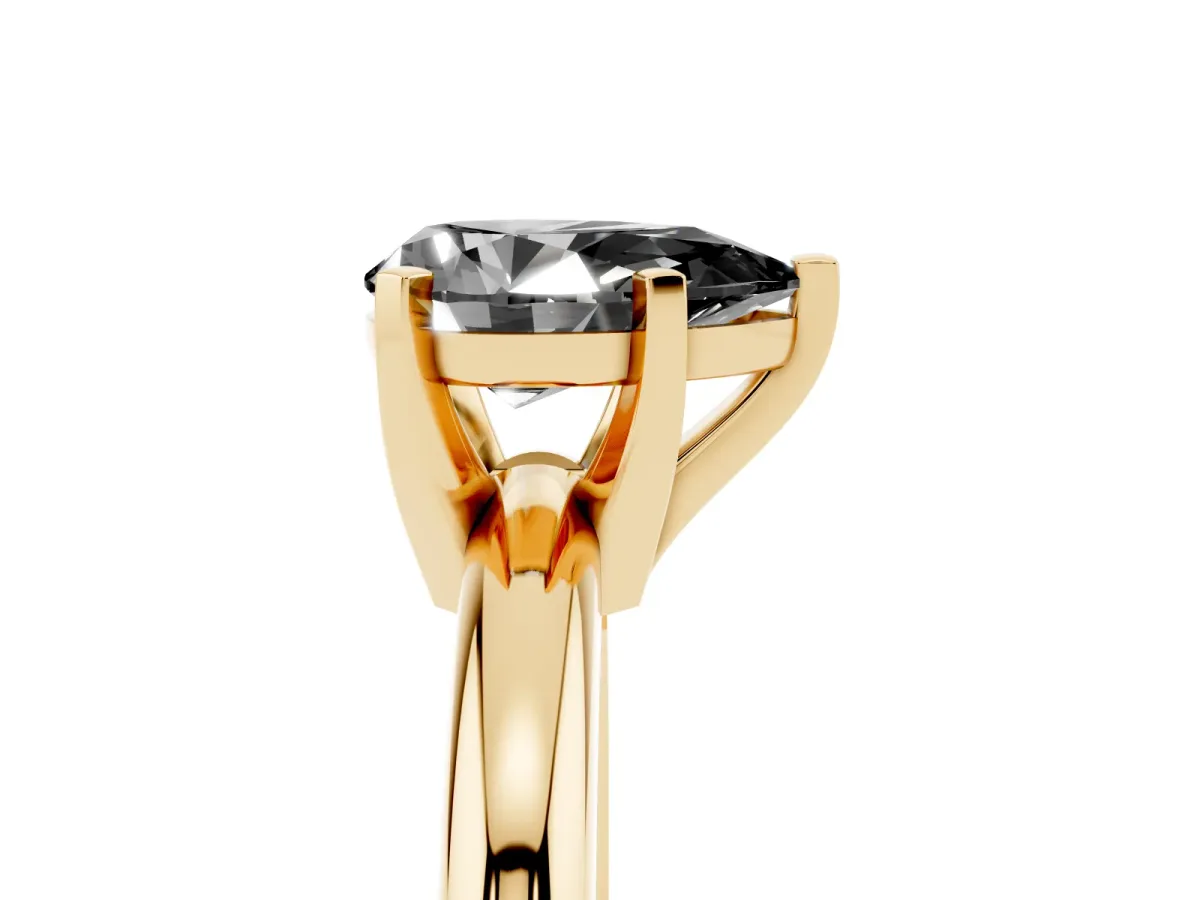 Fancy Black Pear Cut Diamond Solitaire Engagement Ring with Round Band and Four-Prong Setting Yellow gold