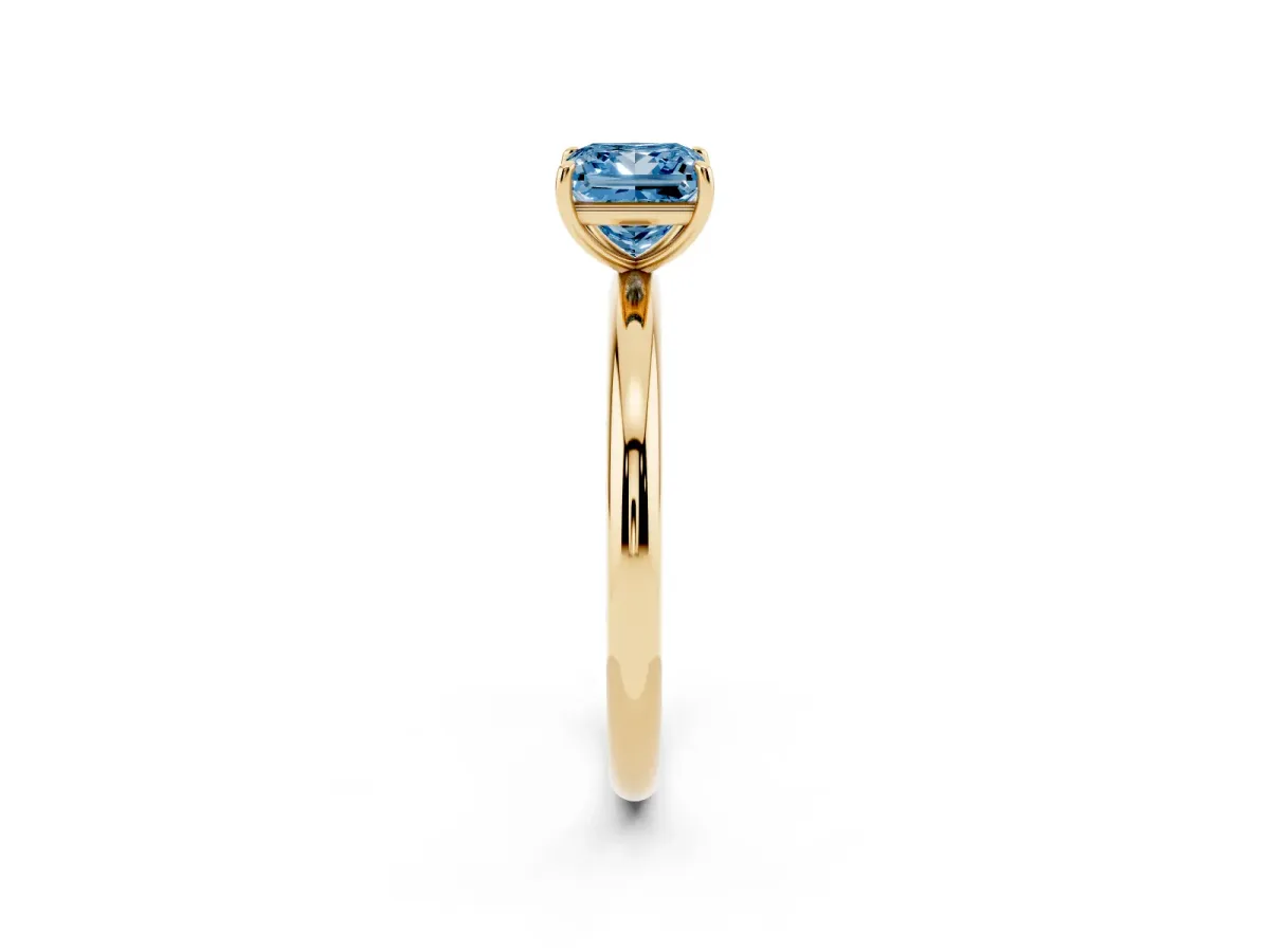 Fancy Blue Princess Cut Solitaire Diamond Ring with Four-Prong Setting on a Plain Band Yellow gold