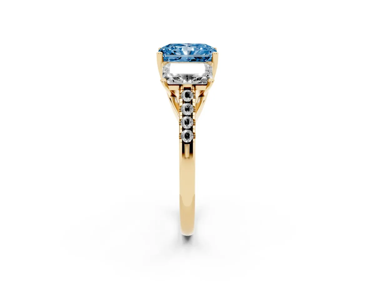 Fancy Blue Three-Stone Radiant Cut Diamond Ring with Round Pavé Band and Prong Setting Yellow gold