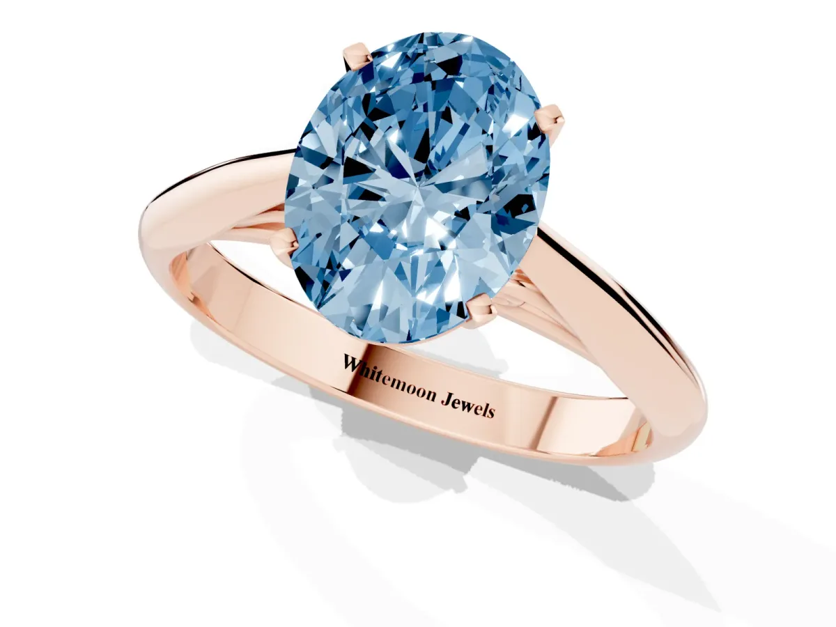 Fancy Blue Oval Cut Diamond Solitaire Engagement Ring with Cathedral Setting and Four-Prong Mount Rose gold