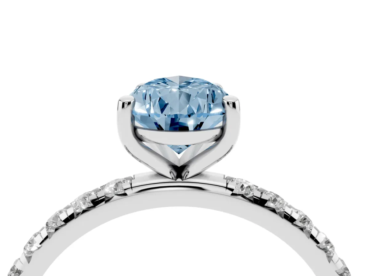 Fancy Blue Pear Cut Cut Diamond Solitaire Ring with Micro Pave Band and Four Prong Setting Silver
