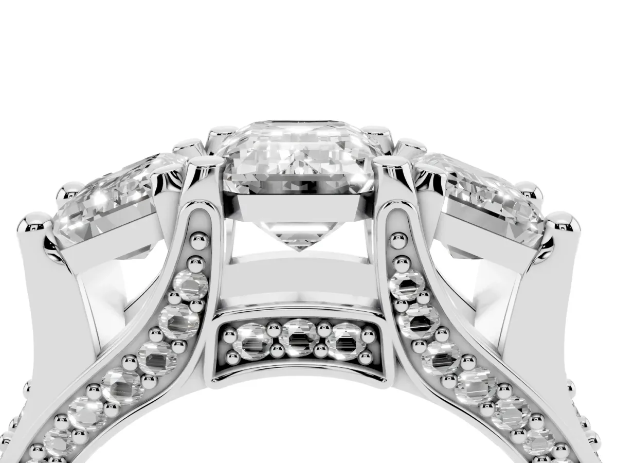 Emerald Cut Diamond Three-Stone Ring with Channel Set Band and Four-Prong Setting Silver