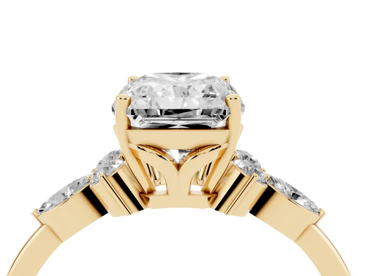 Radiant Cut Brilliant Diamond Solitaire Ring with Pear Side Stones and Four-Prong Setting Yellow gold