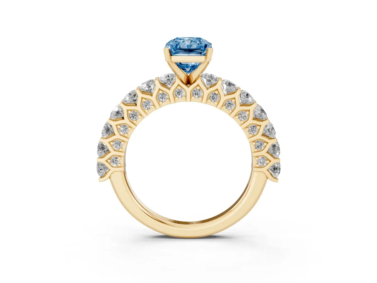 Fancy Blue Radiant Cut Diamond Solitaire Ring with Shared Prong Pavé Band and Four-Prong Setting Yellow gold